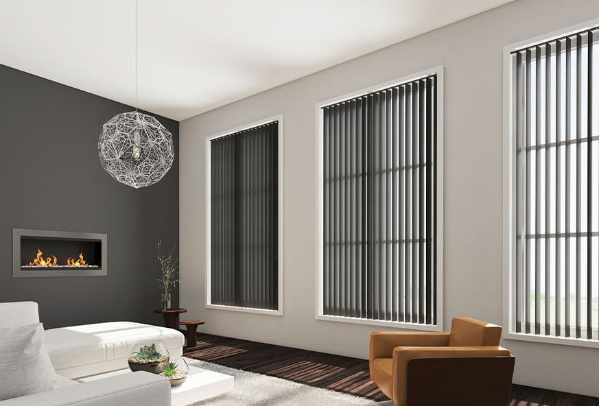 Modern living room with sleek vertical blinds on large windows, a plush sofa, and a geometric chandelier.